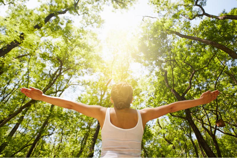 Woman Nurturing her Mental Wellness in the sunshine