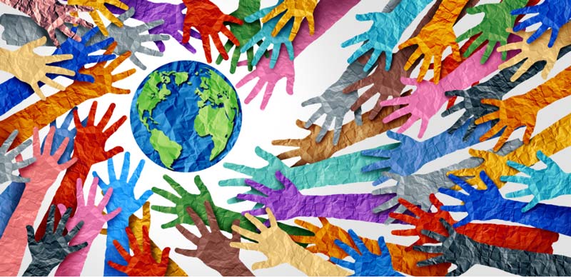 Rainbow Hands symbolizing diversity around a globe.