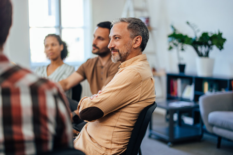 Man listening during Trauma Informed Care Therapy